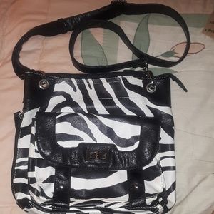 A black and white zebra designed purse